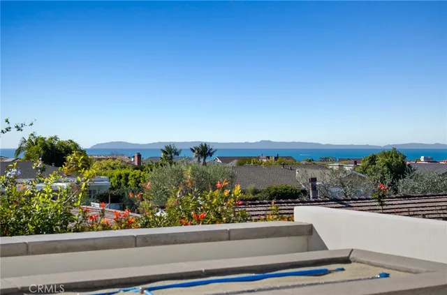 a view of a house with a flat screen tv and couches