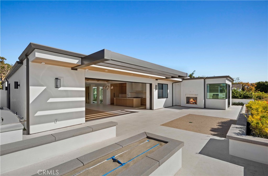 4607 Dorchester Road Corona del Mar, CA 92625 - Photo 8 of 34 a view of a house with a flat screen tv and couches