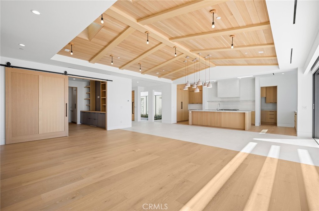 4607 Dorchester Road Corona del Mar, CA 92625 - Photo 9 of 34 a view of an empty room with wooden floor