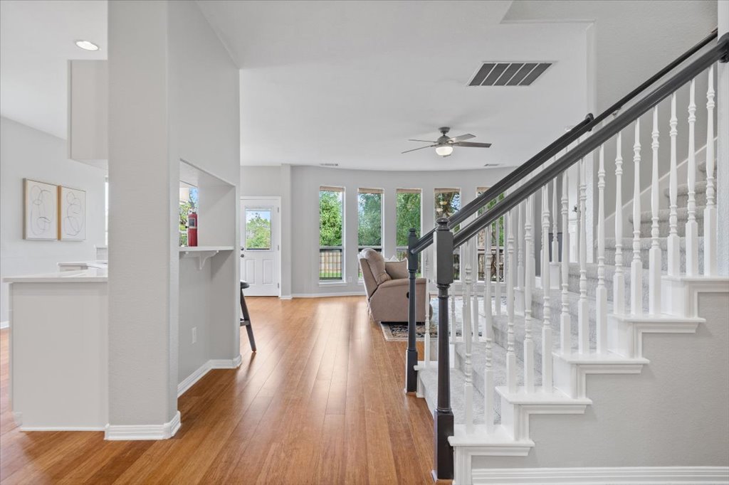 10801 Beachmont Lane Austin, TX 78739 - Photo 4 of 40 As you walk in you'll immediately notice the gorgeous wood floors welcoming you into the space!