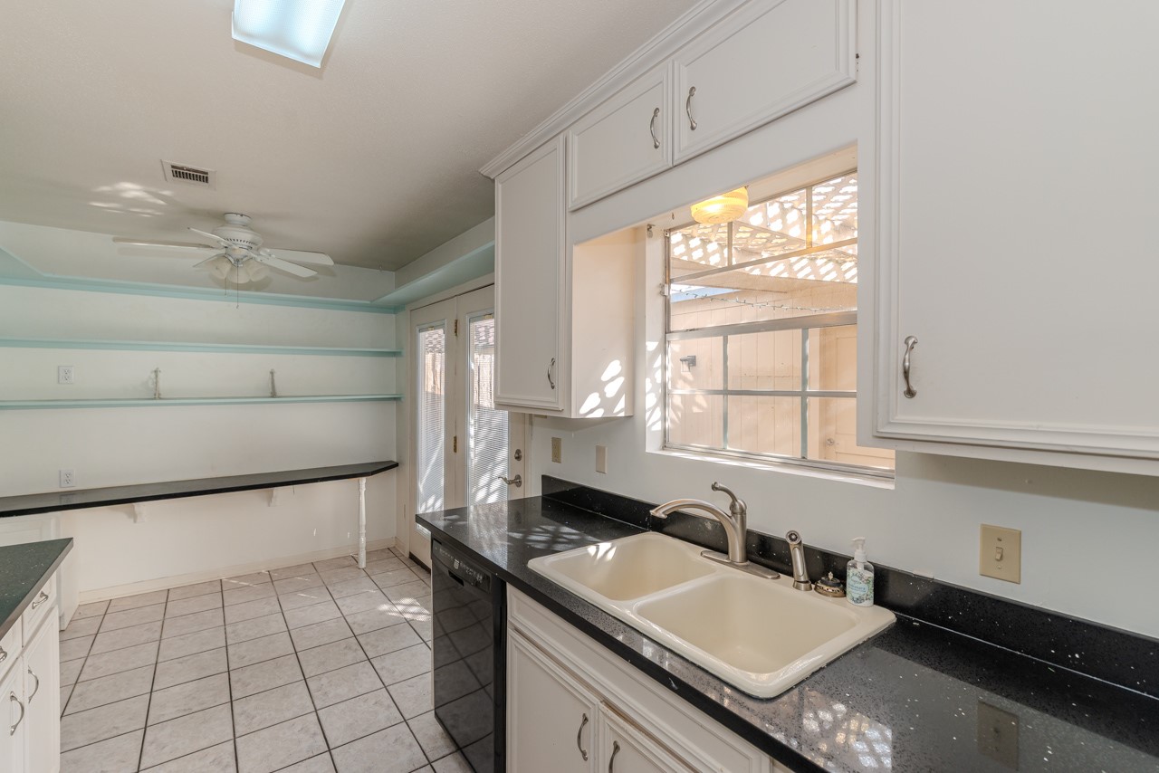 5975 Meadow Way Beaumont, TX 77707 - Photo 7 of 18 a kitchen with a sink and a stove top oven