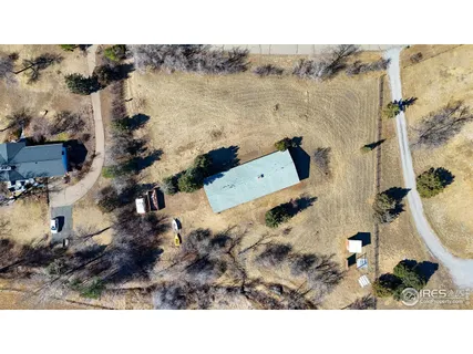 a bird view of house with a lake view