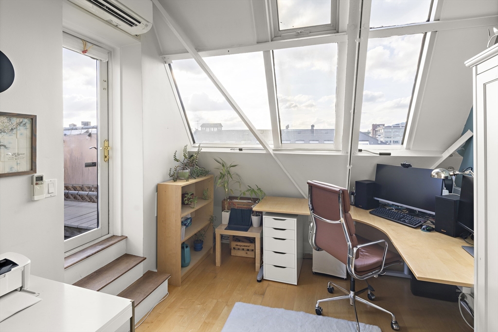42 8th Street, Unit 5514 Boston, MA 02129 - Photo 20 of 38 a view of a workspace with furniture and a window