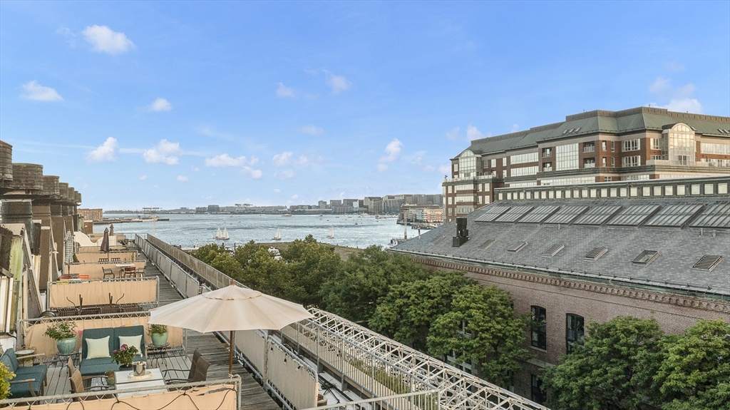 42 8th Street, Unit 5514 Boston, MA 02129 - Photo 2 of 38 a view of a lake with a terrace