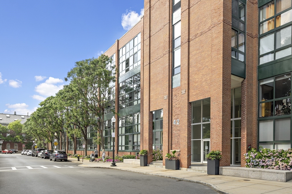 42 8th Street, Unit 5514 Boston, MA 02129 - Photo 29 of 38 front view of a building with a street