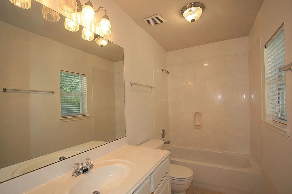 43 Steep Trail Place Conroe, TX 77385 - Photo 12 of 13 a bathroom with a sink a toilet and shower