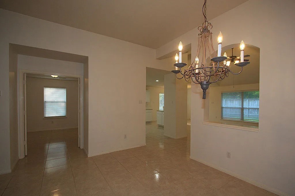 43 Steep Trail Place Conroe, TX 77385 - Photo 13 of 13 a view of a room with a chandelier