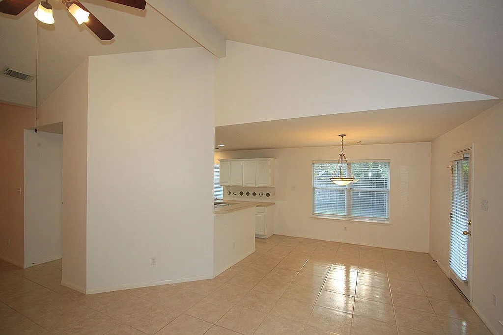 43 Steep Trail Place Conroe, TX 77385 - Photo 9 of 13 a view of empty room with windows