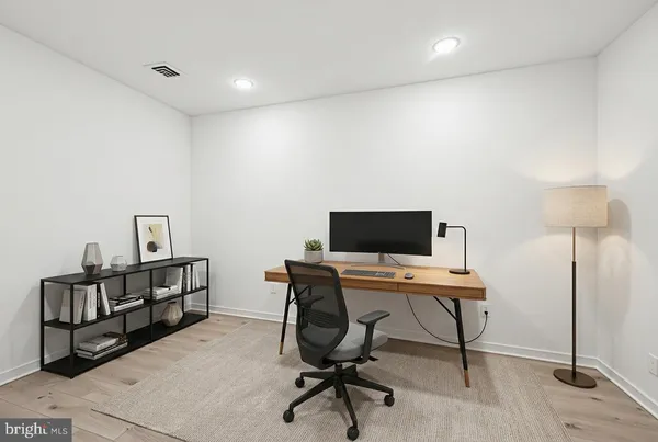 a view of a workspace with furniture