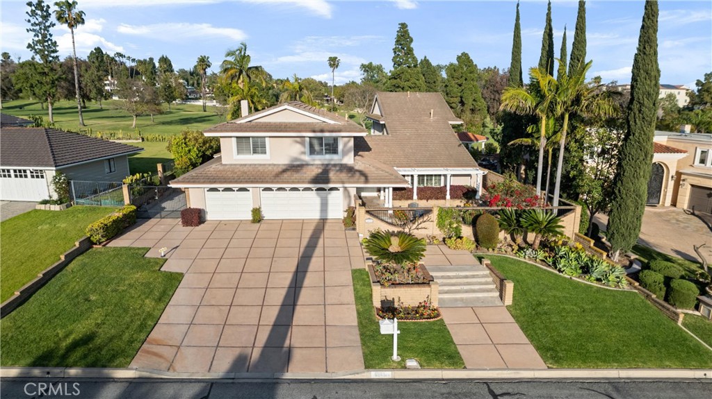 8690 Los Coyotes Drive Buena Park, CA 90621 - Photo 1 of 9 a aerial view of a house with a yard