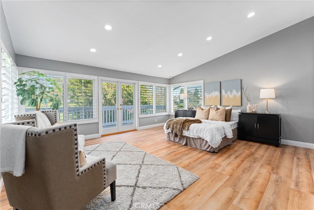 8690 Los Coyotes Drive Buena Park, CA 90621 - Photo 8 of 9 a spacious bedroom with a large bed and a large window