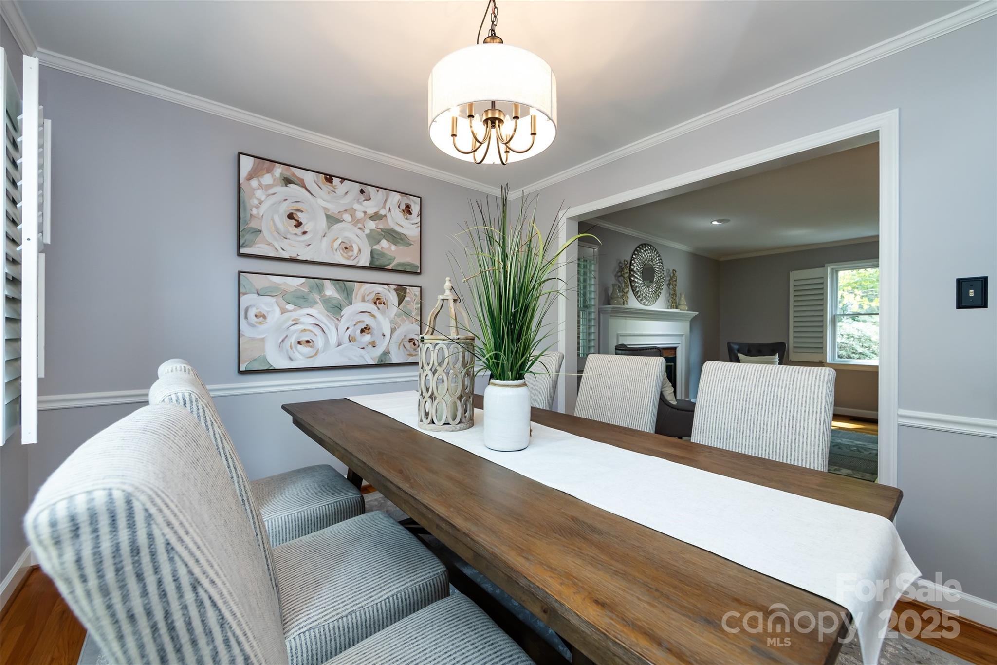 757 Concord Road Davidson, NC 28036 - Photo 12 of 46 a living room with furniture and paintings on the wall