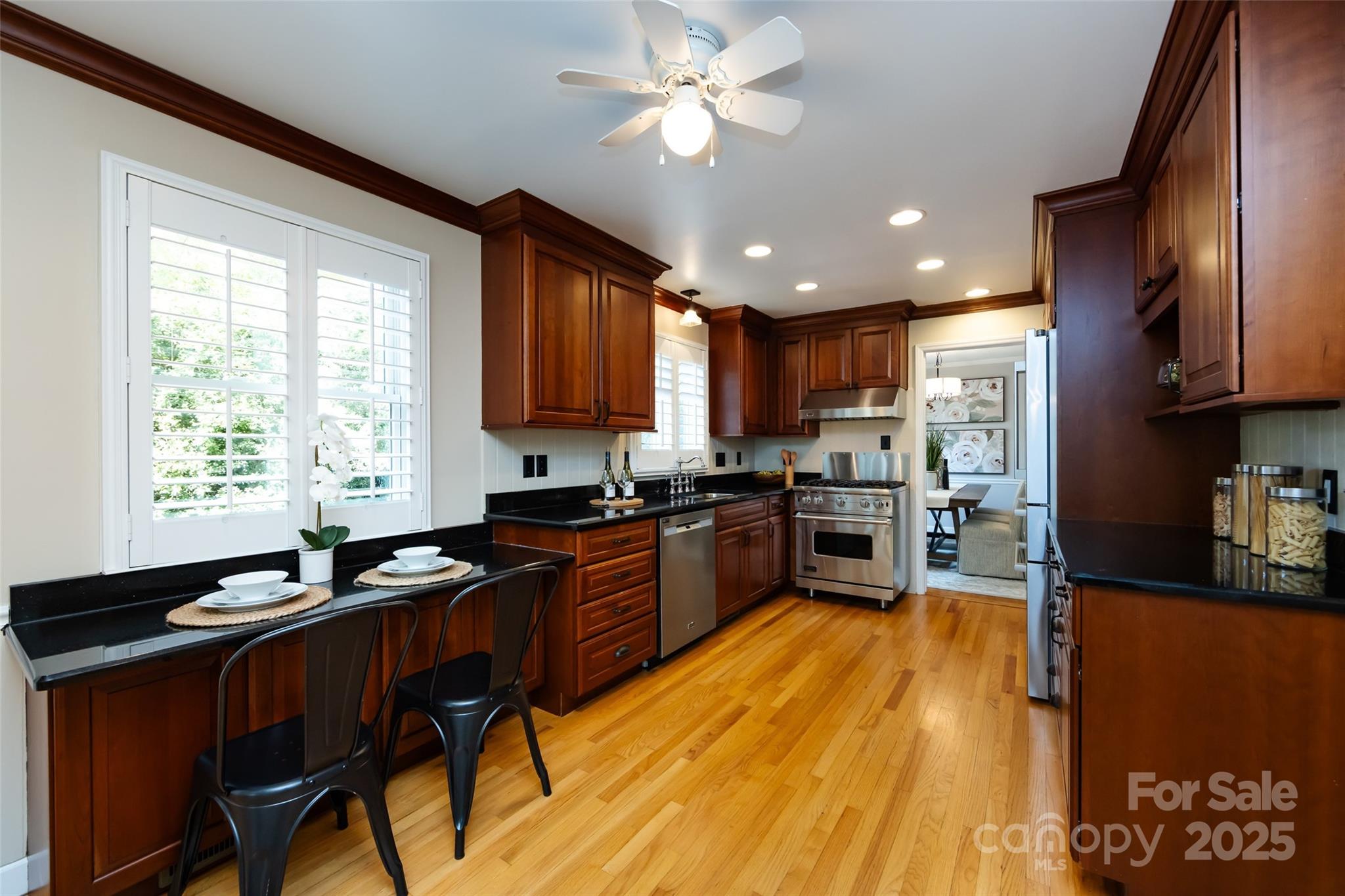 757 Concord Road Davidson, NC 28036 - Photo 14 of 46 a kitchen with stainless steel appliances granite countertop sink stove top oven and cabinets