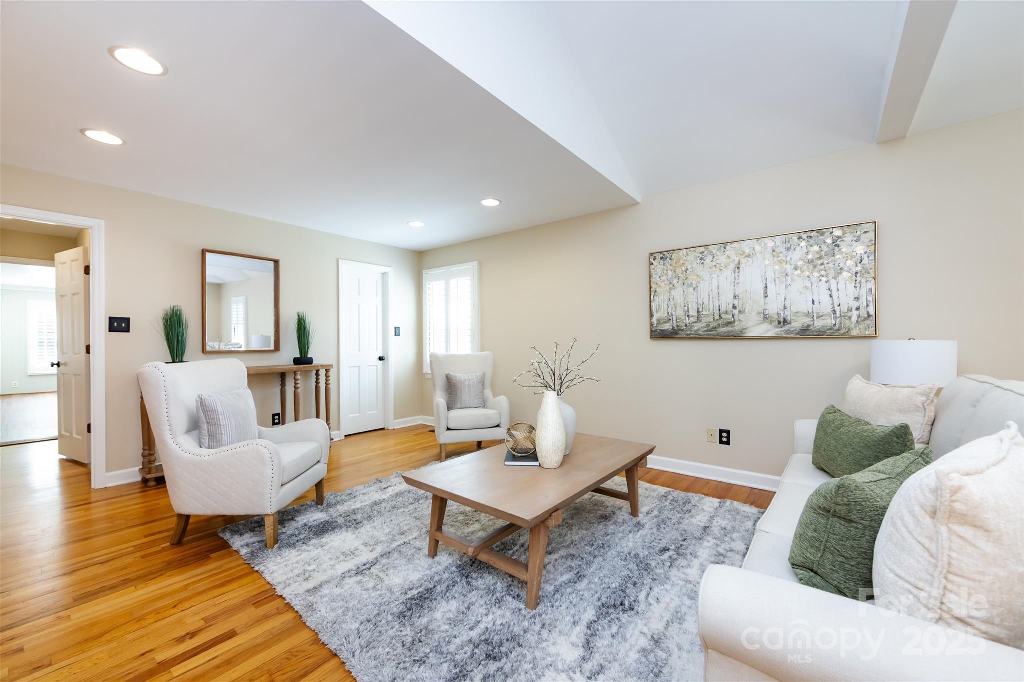 757 Concord Road Davidson, NC 28036 - Photo 19 of 46 a living room with furniture and wooden floor