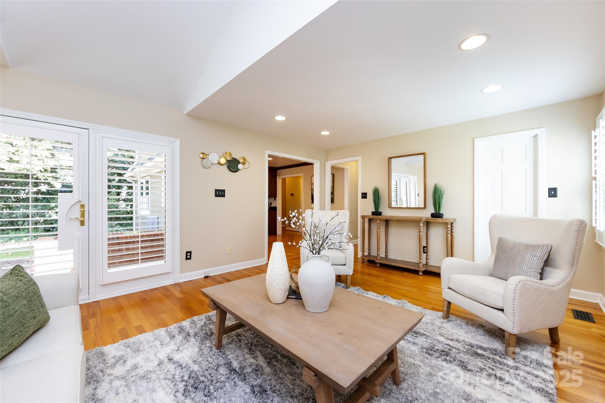 757 Concord Road Davidson, NC 28036 - Photo 20 of 46 a living room with furniture and wooden floor
