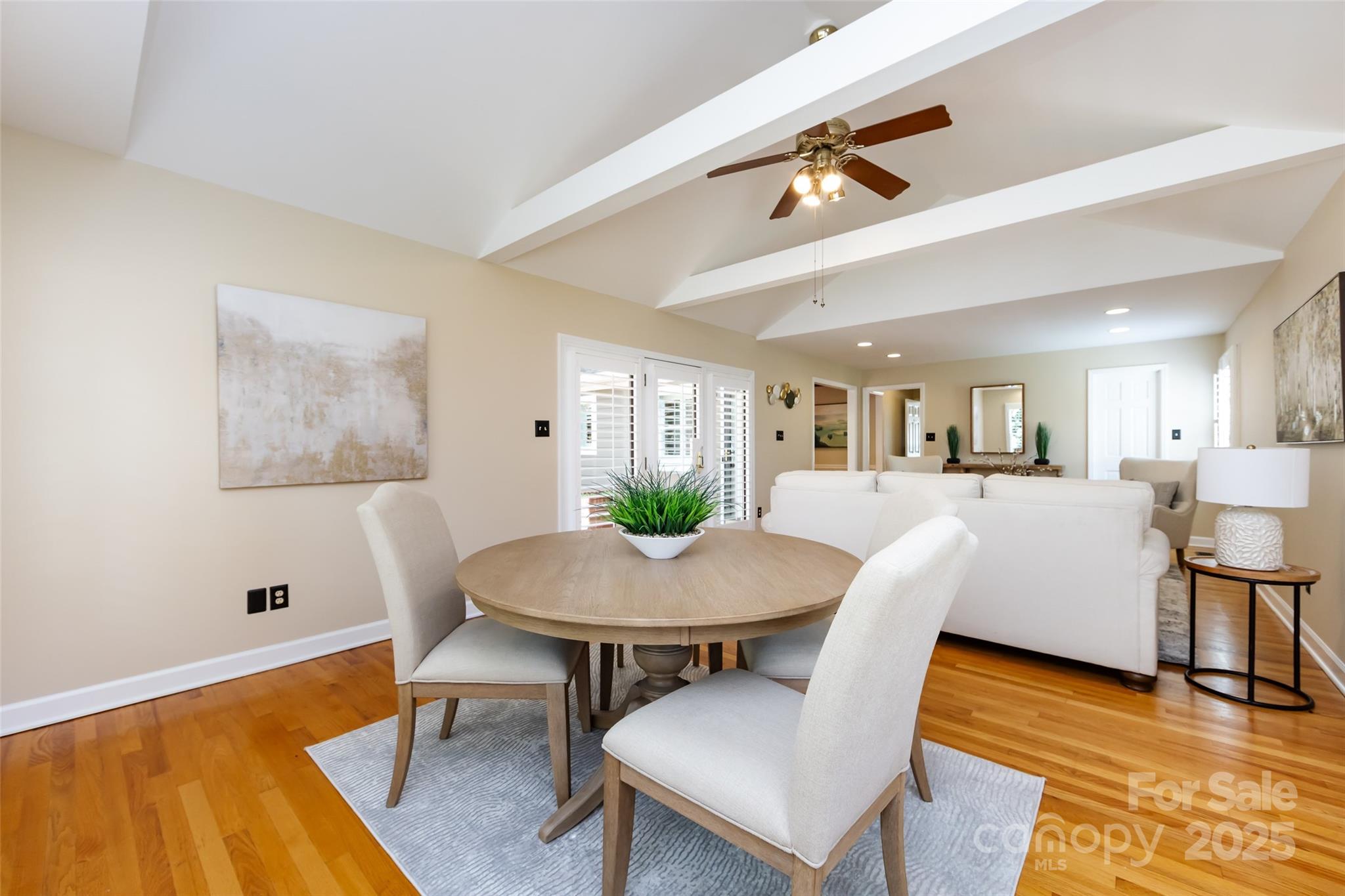 757 Concord Road Davidson, NC 28036 - Photo 22 of 46 a view of a dining room with furniture and wooden floor