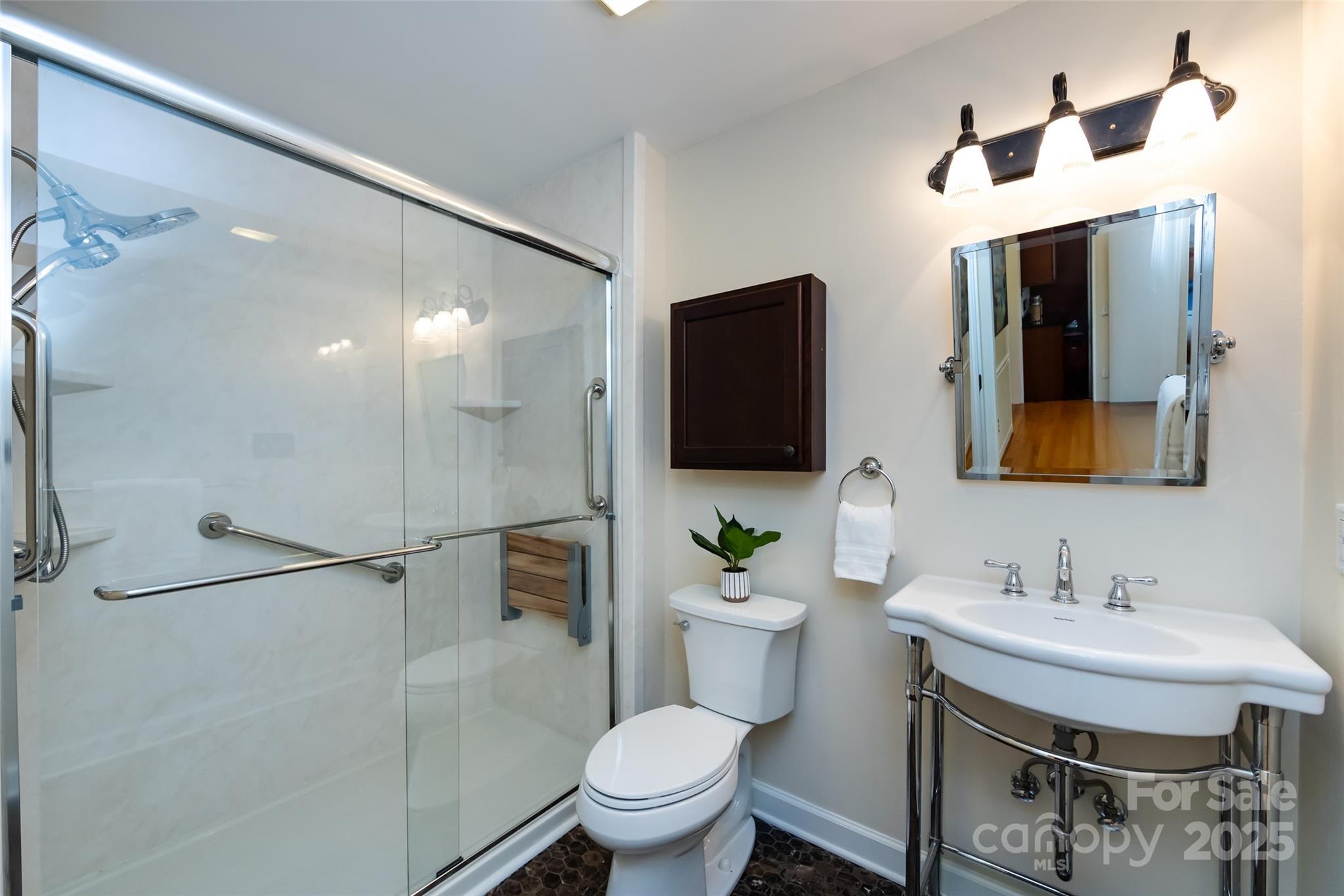 757 Concord Road Davidson, NC 28036 - Photo 23 of 46 a bathroom with a sink toilet and shower