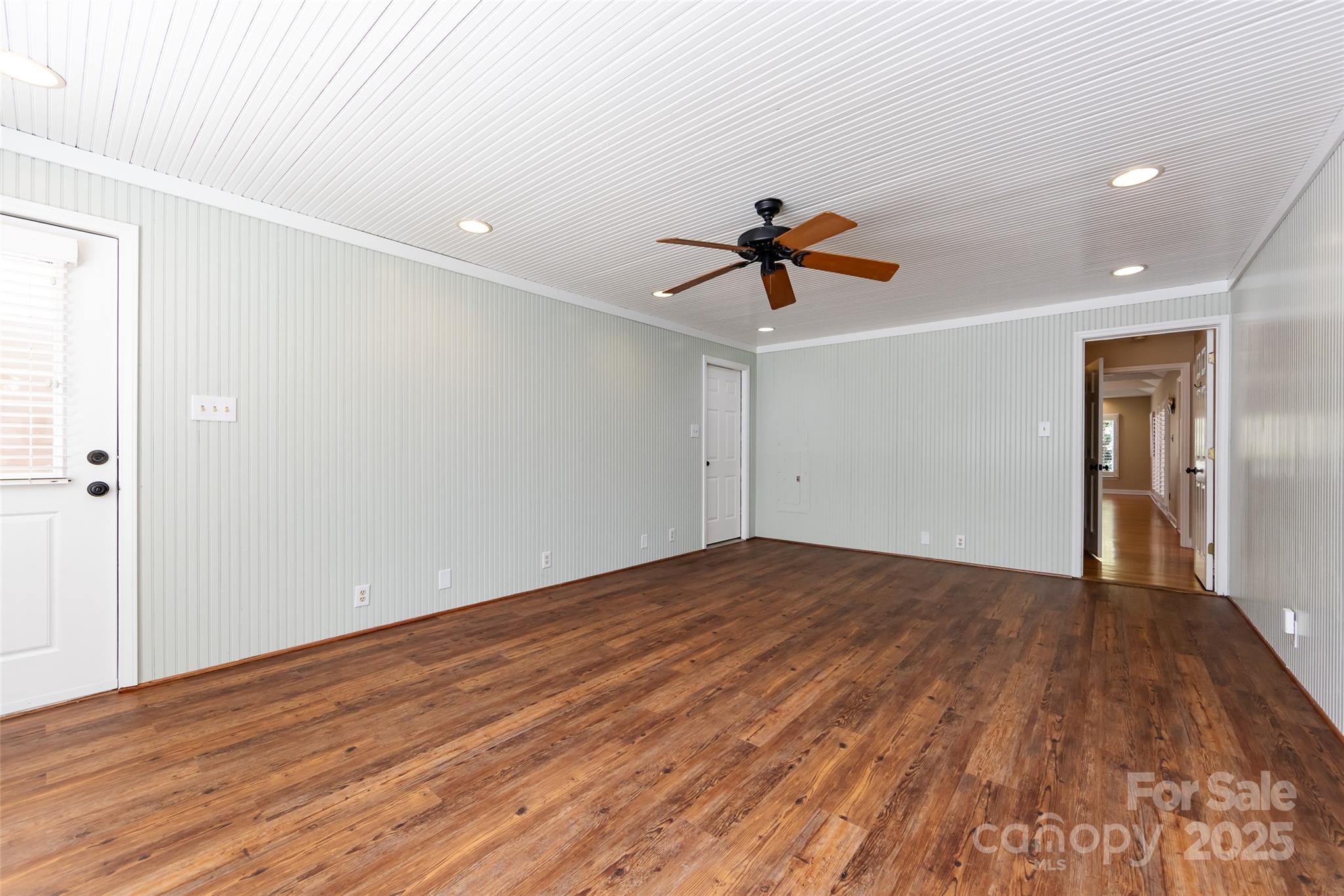 757 Concord Road Davidson, NC 28036 - Photo 25 of 46 a view of empty room with wooden floor and fan