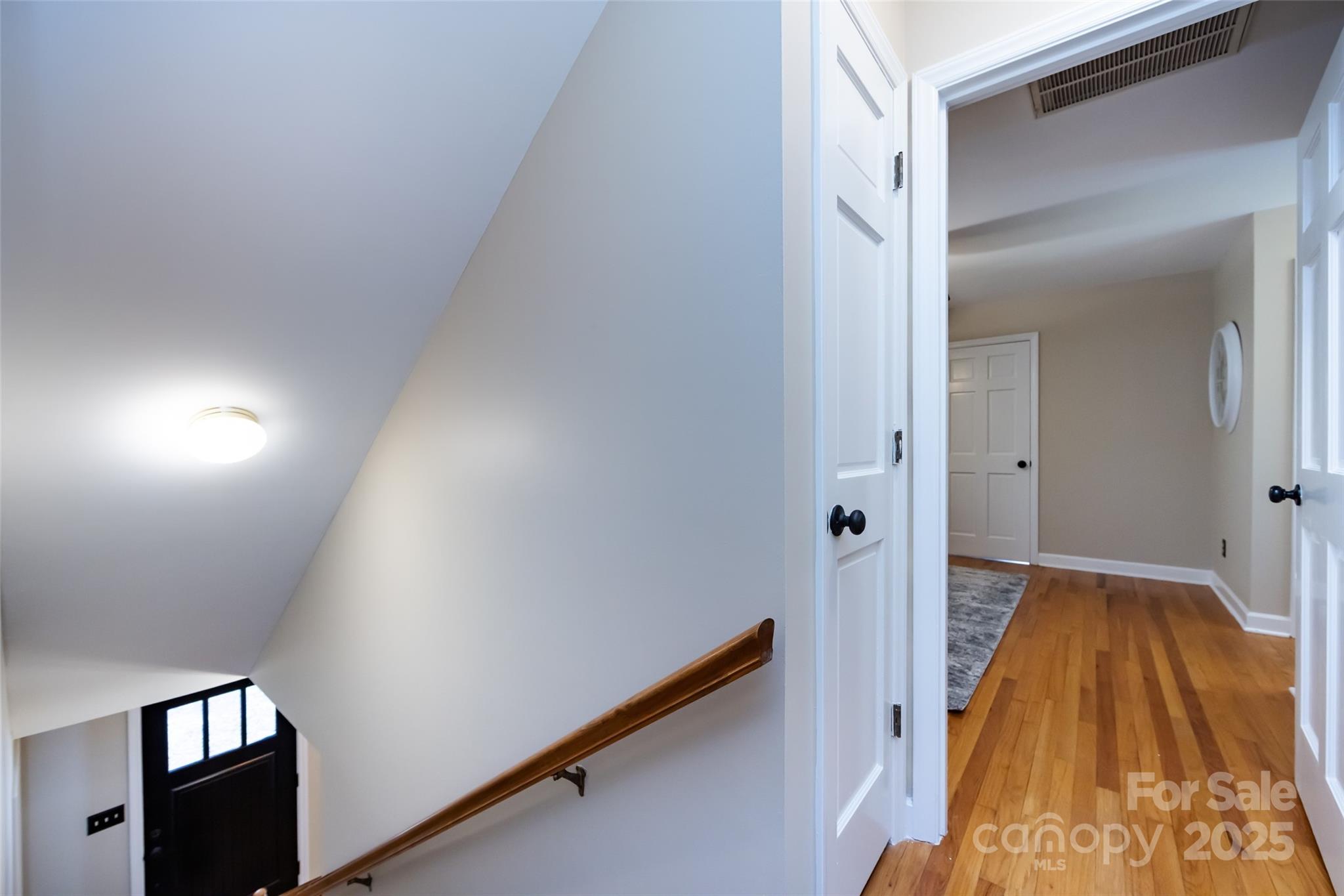 757 Concord Road Davidson, NC 28036 - Photo 26 of 46 a view of hallway with wooden floor