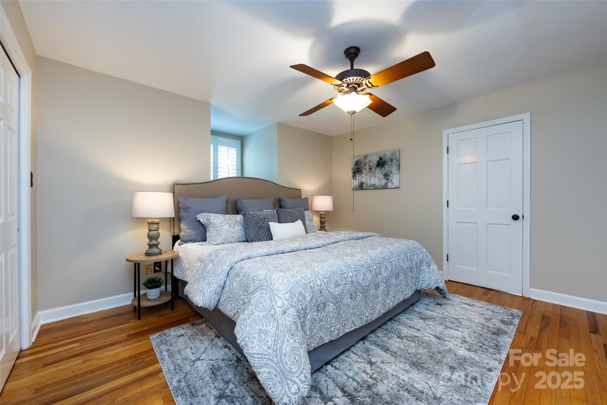 757 Concord Road Davidson, NC 28036 - Photo 28 of 46 a bedroom with a bed and wooden floor