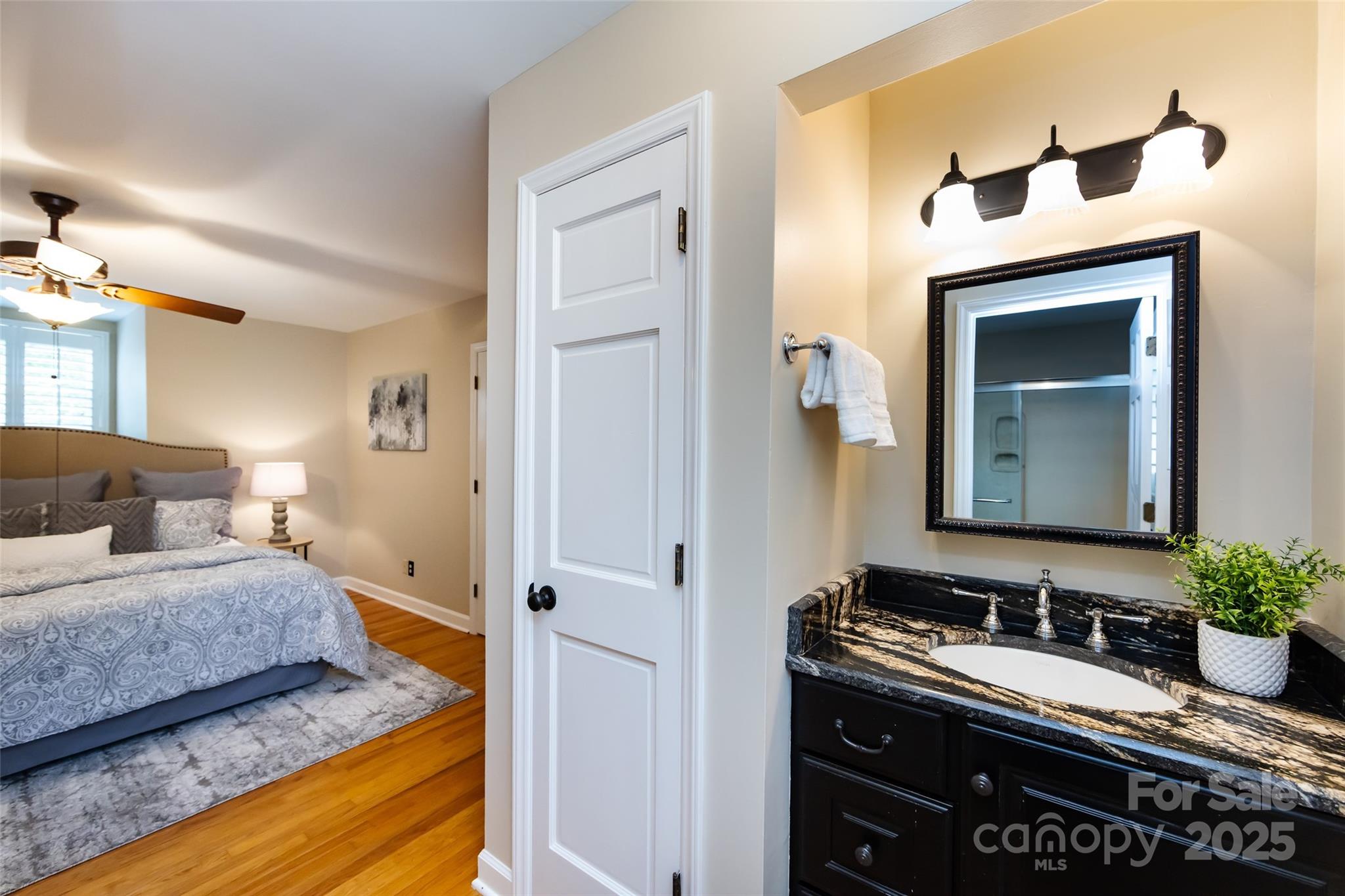 757 Concord Road Davidson, NC 28036 - Photo 29 of 46 a en suite bathroom with a granite countertop sink and a mirror