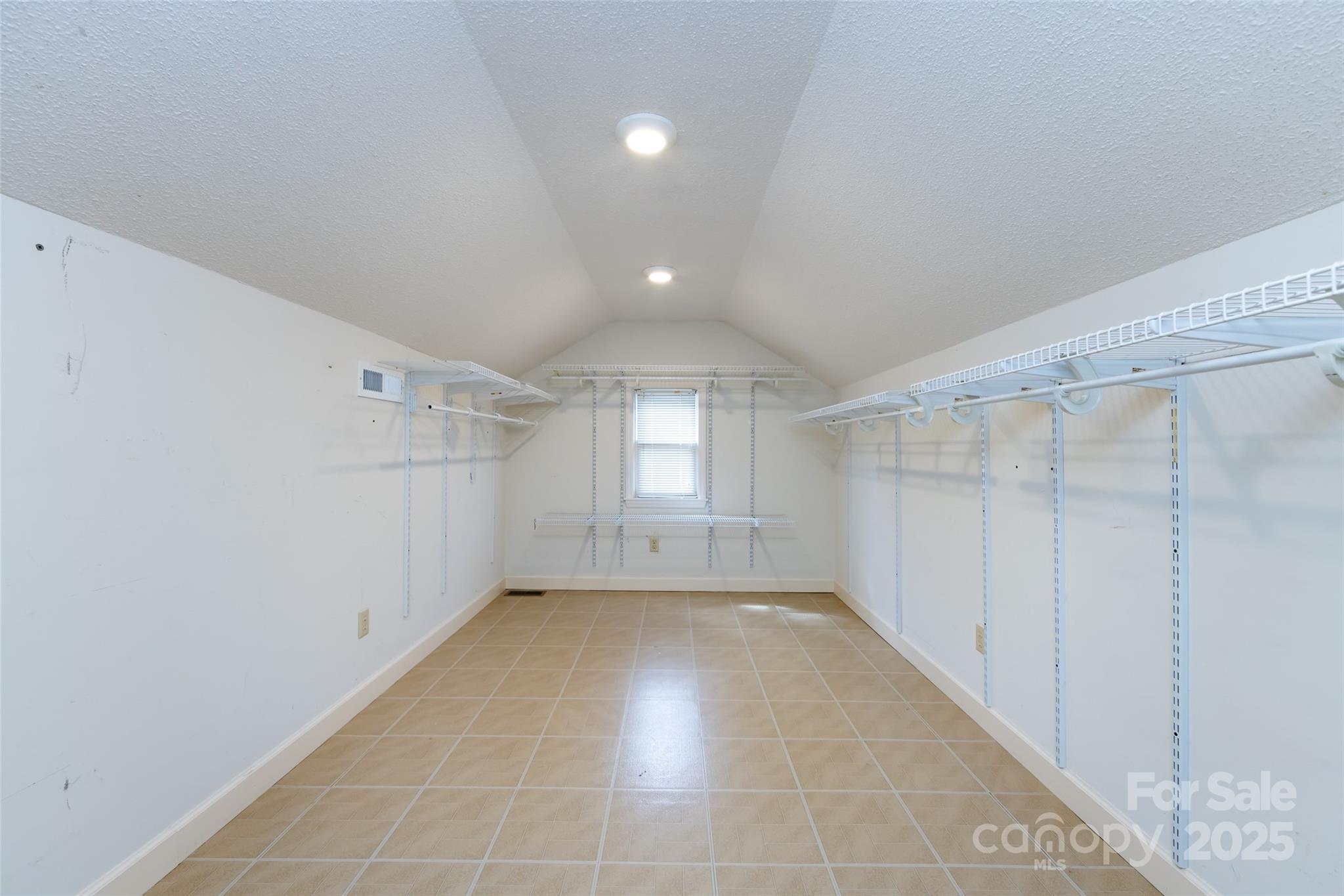 757 Concord Road Davidson, NC 28036 - Photo 31 of 46 a view of a room with a wooden floor and window