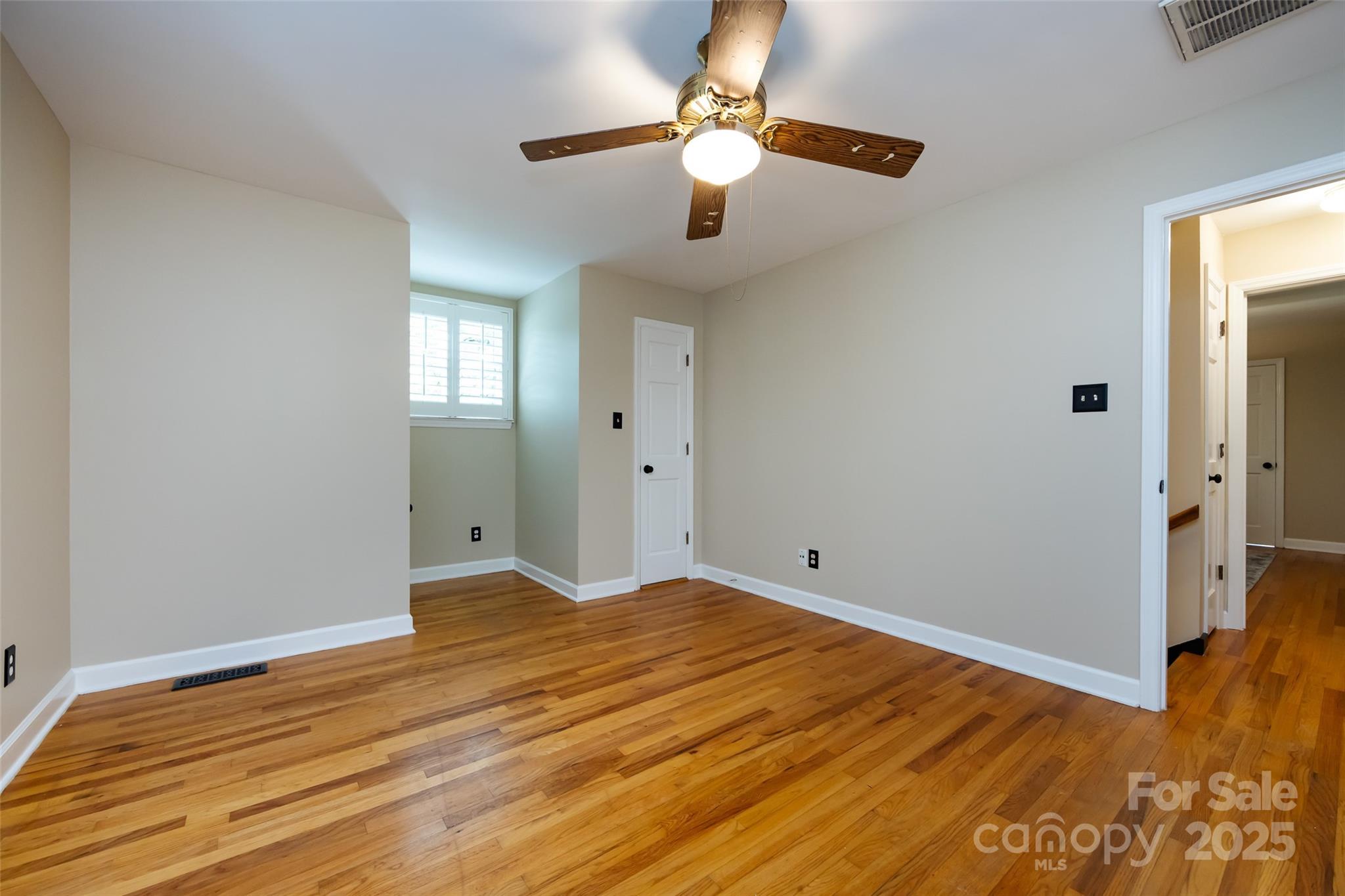 757 Concord Road Davidson, NC 28036 - Photo 33 of 46 a view of an empty room with wooden floor