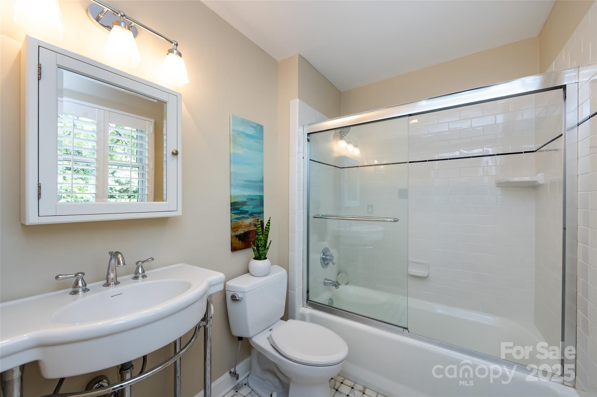 757 Concord Road Davidson, NC 28036 - Photo 34 of 46 a bathroom with a sink toilet and shower