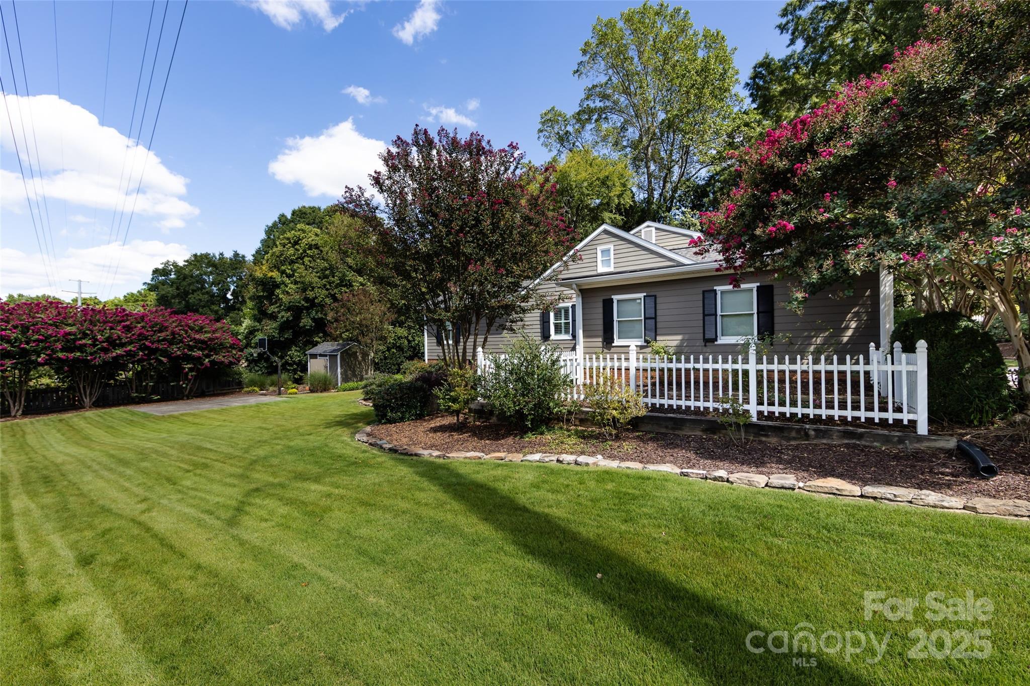 757 Concord Road Davidson, NC 28036 - Photo 37 of 46 a view of a house with a yard and fence