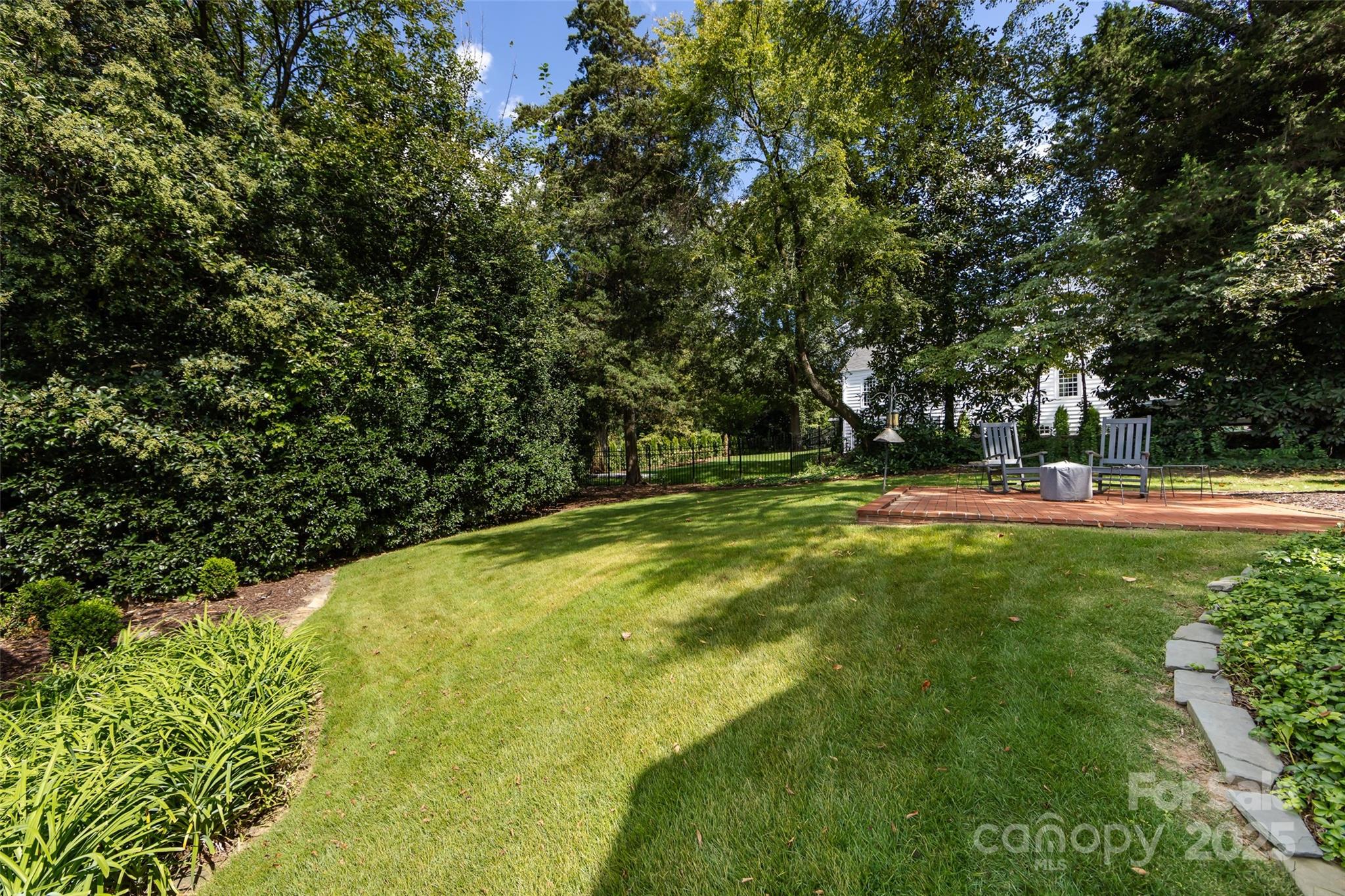 757 Concord Road Davidson, NC 28036 - Photo 38 of 46 a swimming pool with trees in the background
