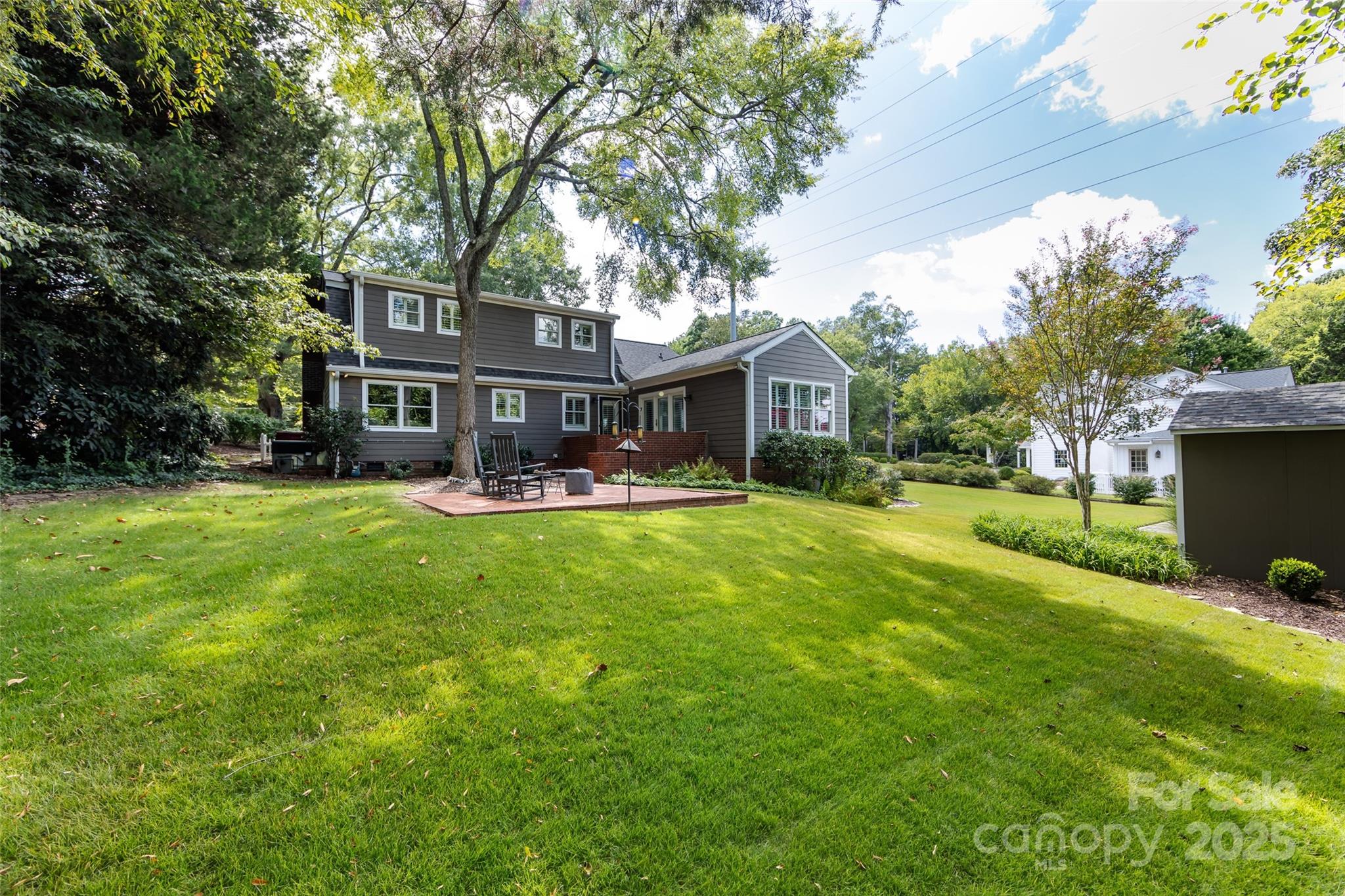 757 Concord Road Davidson, NC 28036 - Photo 39 of 46 a front view of a house with a yard table and chairs