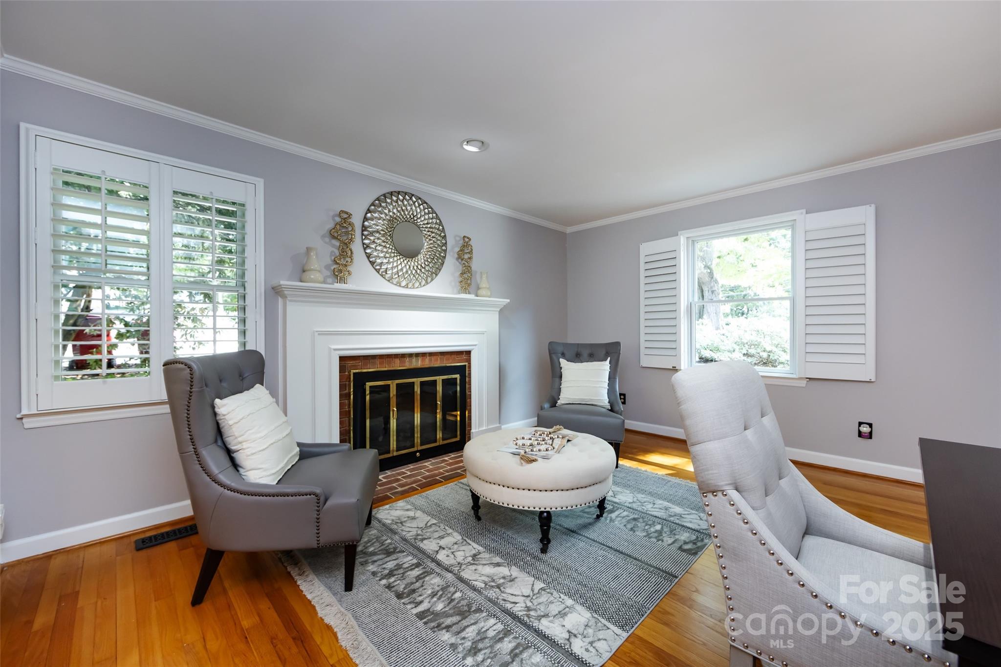 757 Concord Road Davidson, NC 28036 - Photo 10 of 46 a living room with furniture a window and a fireplace
