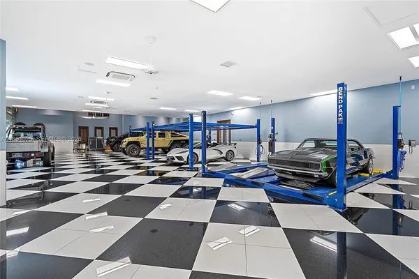 a living room with furniture large window and a flat screen tv