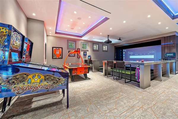 a room with lots of tables a large window and chairs