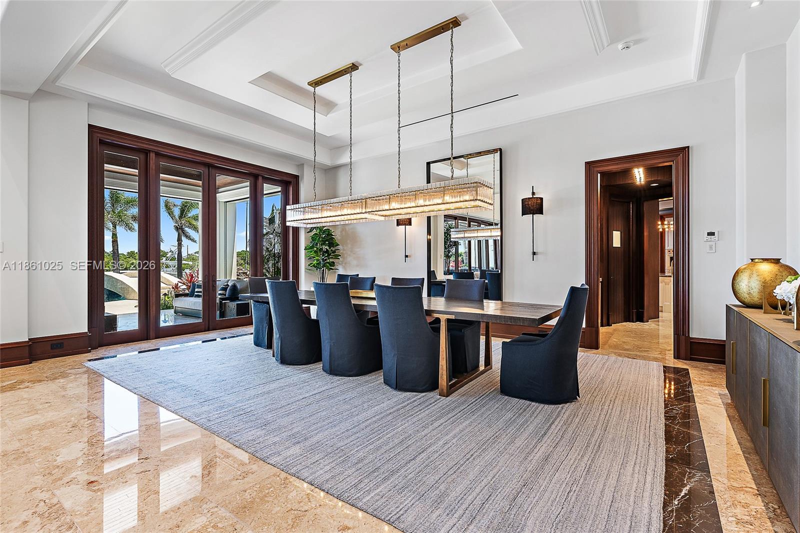 176 Spyglass Lane Jupiter, FL 33477 - Photo 28 of 79 a kitchen view of a table and chairs in a room