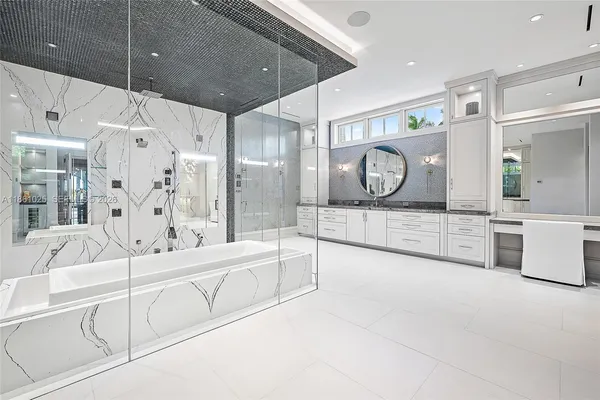 a living room with furniture a flat screen tv and a window