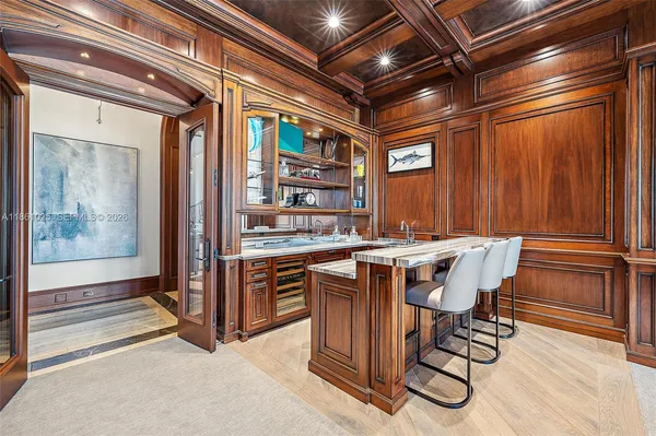 a spacious bathroom with a granite countertop tub double vanity sink and a large mirror