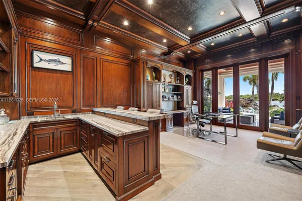 a kitchen with cabinets appliances and a sink