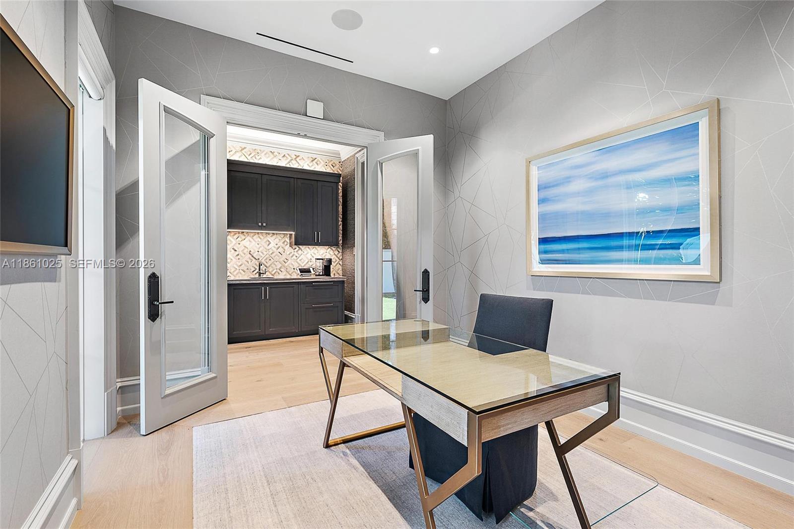 176 Spyglass Lane Jupiter, FL 33477 - Photo 42 of 79 a living room with furniture a rug and a painting