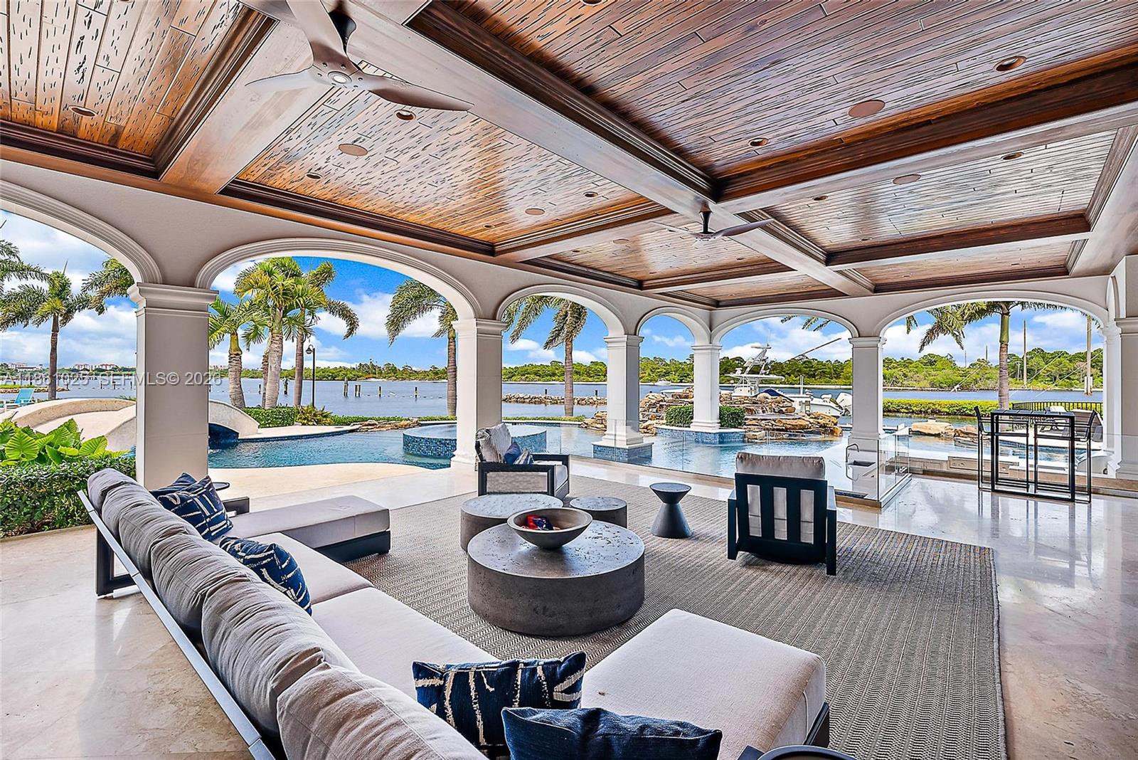 176 Spyglass Lane Jupiter, FL 33477 - Photo 48 of 79 a living room with furniture and a large window