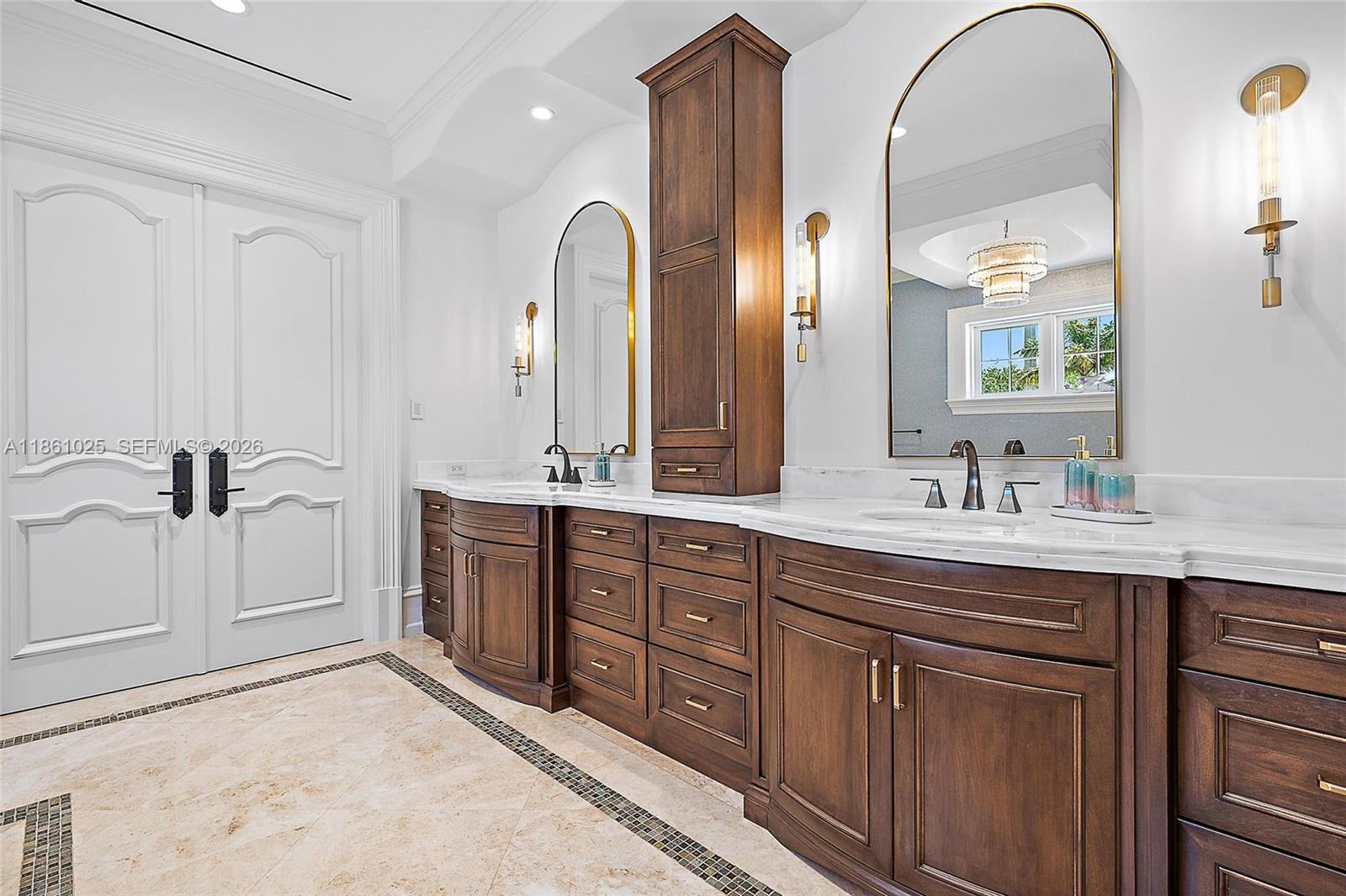 176 Spyglass Lane Jupiter, FL 33477 - Photo 57 of 79 a spacious bathroom with a double vanity sink and mirror