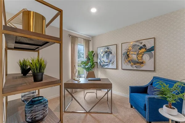 a living room with furniture and a potted plant
