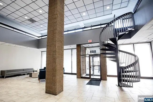 a view of cars parked in front of a house