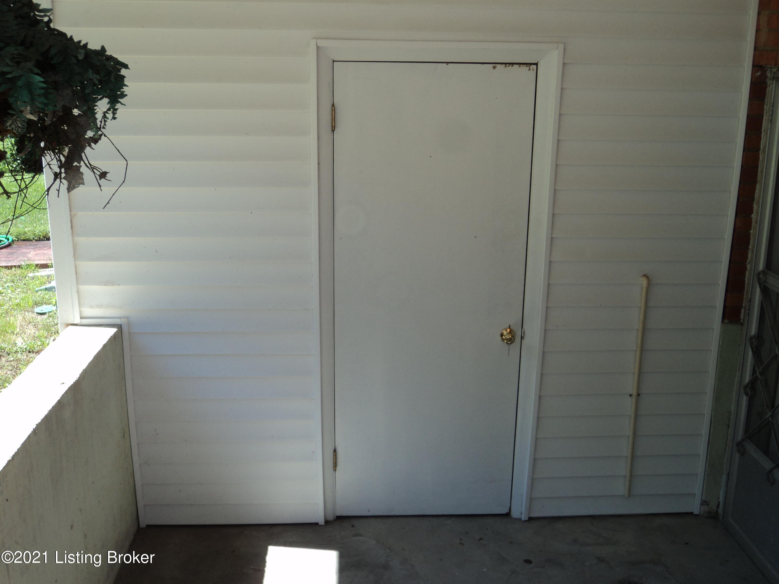 1860 Lynn Lea Road Louisville, KY 40216 - Photo 29 of 38 Outside Entrance to Storage Area which Houses the Water Heater and Sump Pump