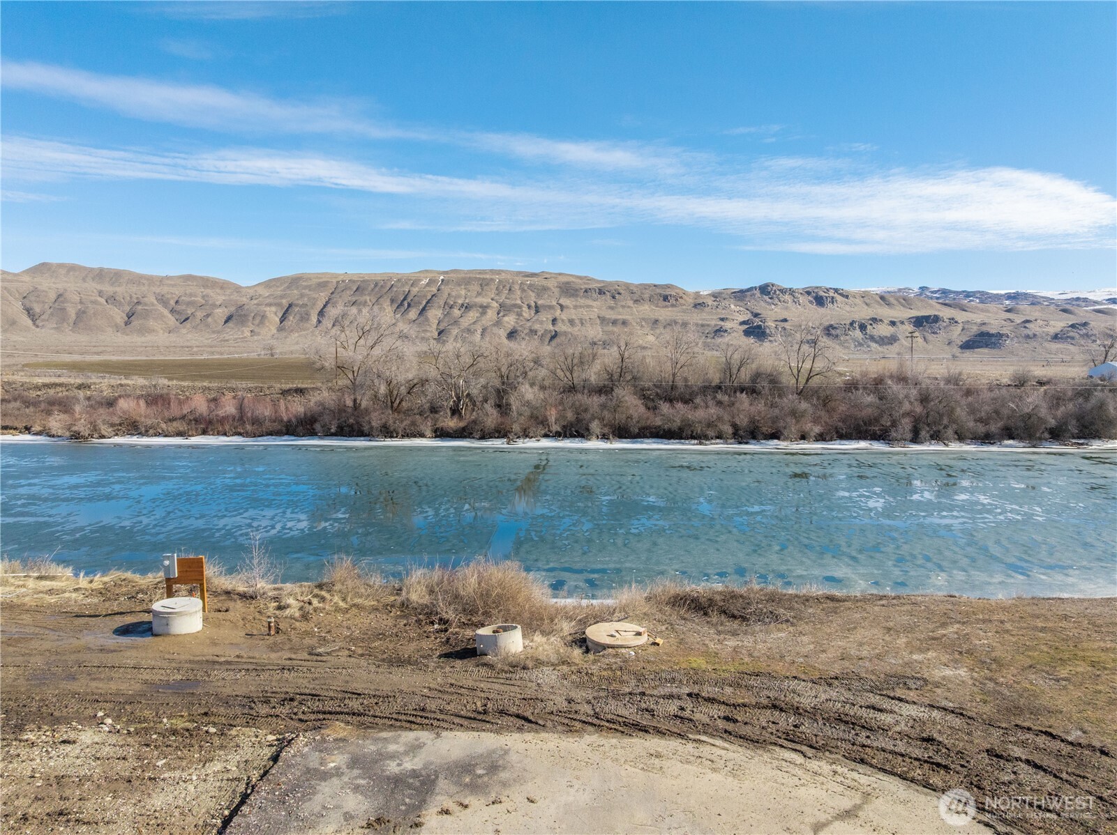 626 Monse River Road Brewster, WA 98812 - Photo 40 of 40 a view of a lake with mountains in the background