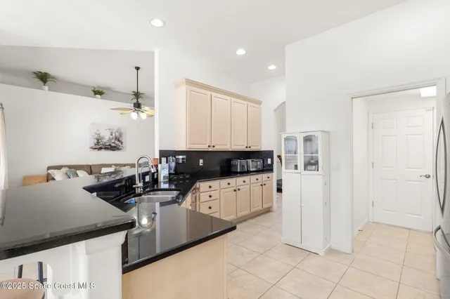 a kitchen with cabinets and window