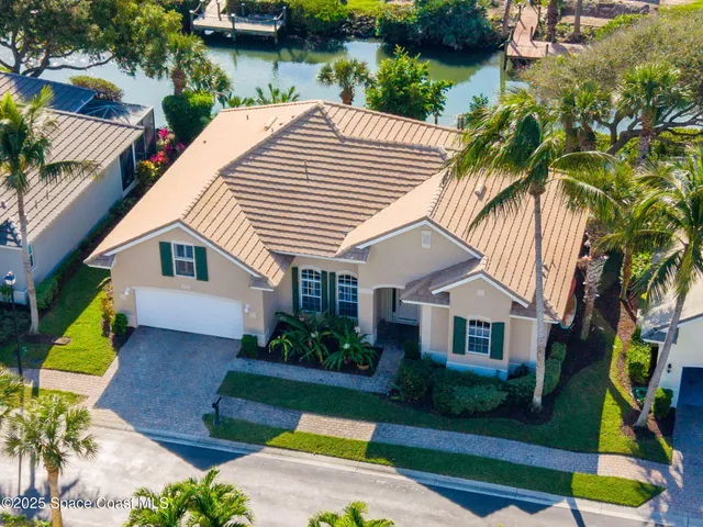 a view of a house with a yard and plants
