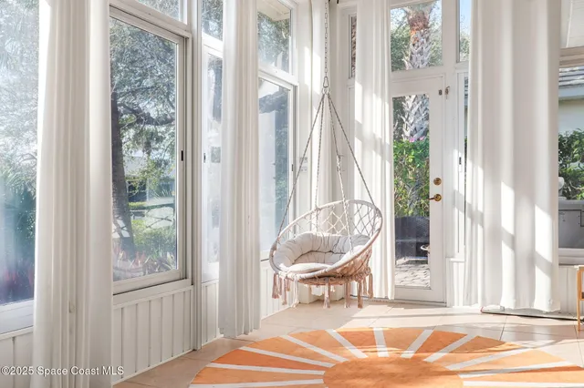 a living room with a furniture and a window