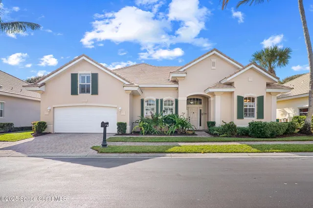 a view of a house with a swimming pool and a big yard