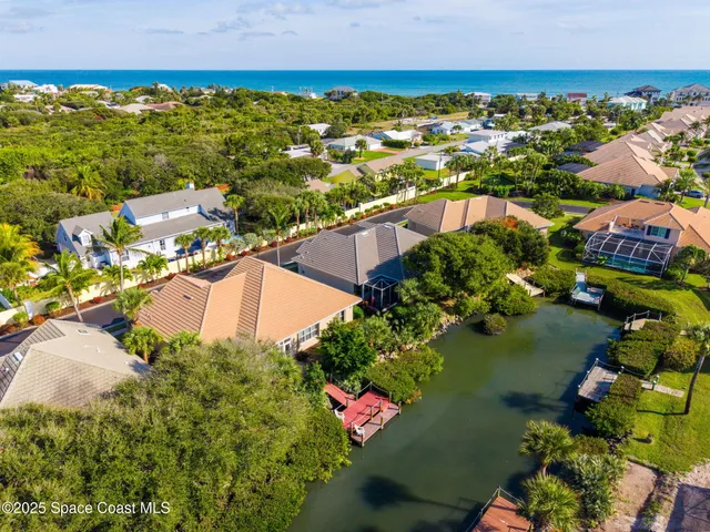 an aerial view of residential houses with outdoor space